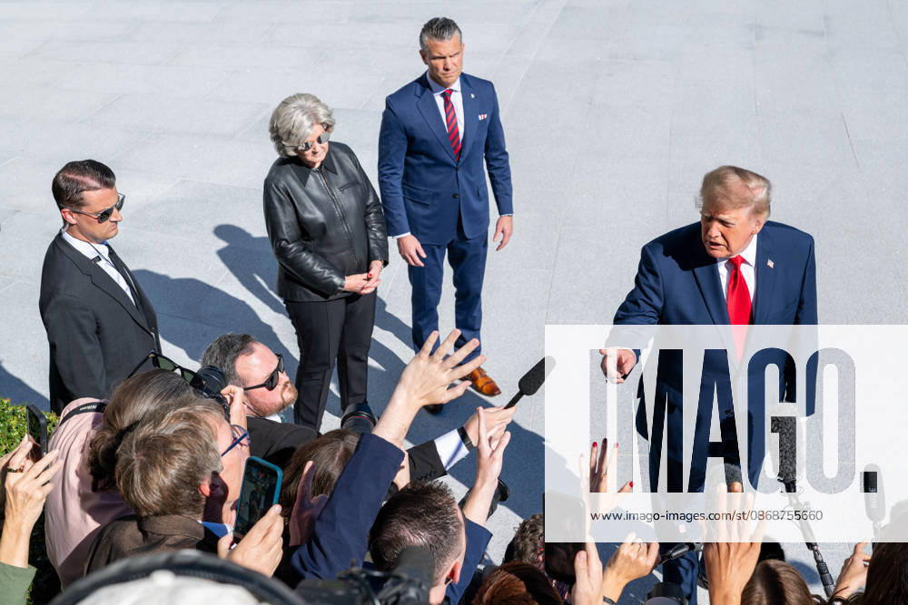 President DONALD TRUMP speaks to reporters on the South Lawn of the White House before departing for Baltimore, Maryland, as Secretary of War PETE HEGSETH and White House Chief of Staff SUSIE WILES stand behind him. Washington United States - ZUMAk206 20261006_znp_k206_004