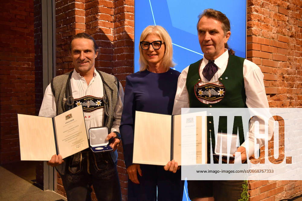 Bavarian State Minister Ulrike Scharf with Alexander Huber and Thomas Huber (Huber Buam) at the presentation of the Bavarian State Medal for Social Merit at the All Saints Hofkirche