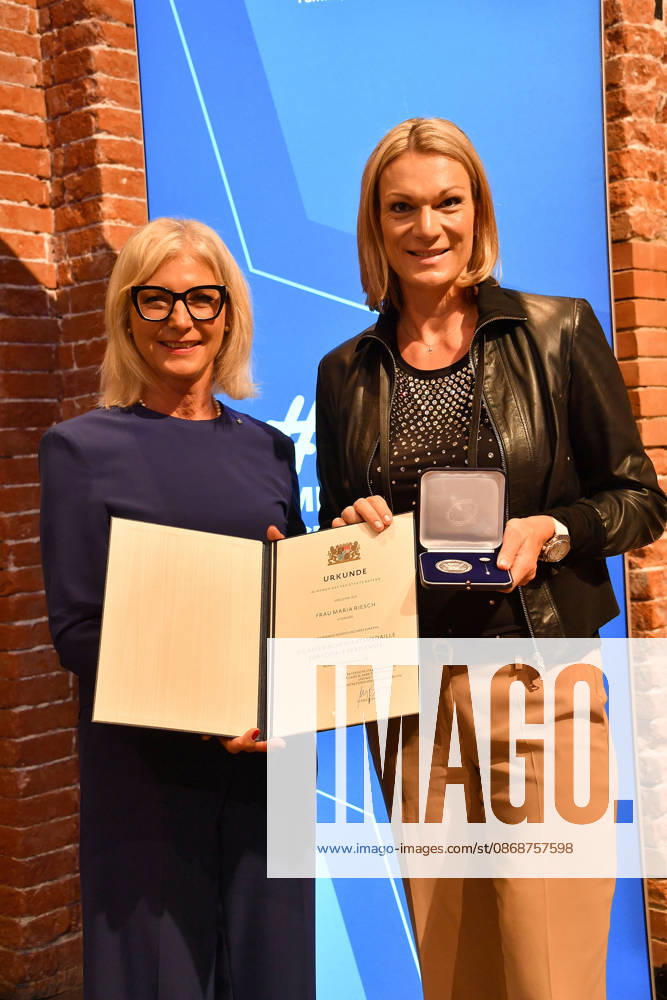 Bavarian State Minister Ulrike Scharf and award recipient Maria Riesch at the presentation of the Bavarian State Medal for Social Merit in the All Saints Court Church, Residenz on October 6, 2026, in Munich