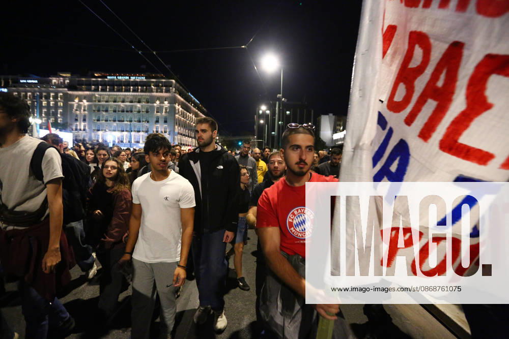 A demonstrator carries a banner as protesters march through central Athens during an anti-war demonstration opposing the visit of US Secretary of State MARCO RUBIO. Athens GREECE - ZUMAx103 20261006_zip_x103_016