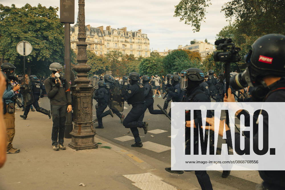Paris Students Protest Education Conditions Demonstrators and photographers move quickly as riot police advance across a junction in Paris, France, on October 6, 2026. France s Interior Ministry said 256,000 people marched nationwide, including 56,000 in Paris, during the student-led day of action over school conditions. High school students called for more education funding and staff, smaller classes and improved facilities, with teachers, parents and unions joining demonstrations. Paris Ile de France France