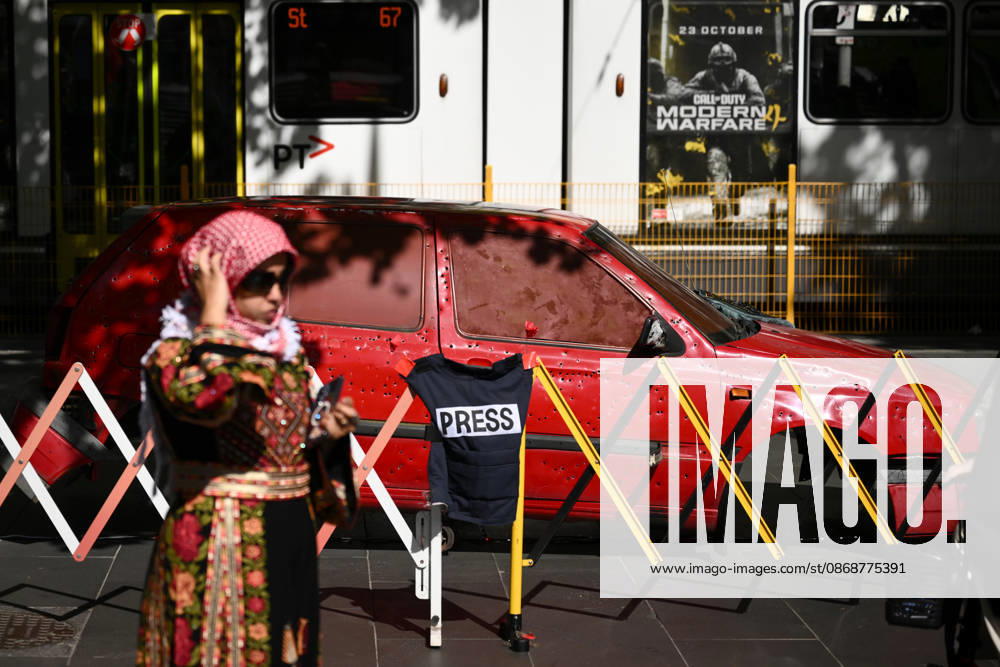 PRO-PALESTINE VIGIL, An installation featuring a replica bullet-riddled car as pro-Palestine protestors hold a vigil for Gaza at the State Library Victoria in Melbourne, Wednesday, October 7, 2026. ( NO ARCHIVING MELBOURNE VICTORIA Australia