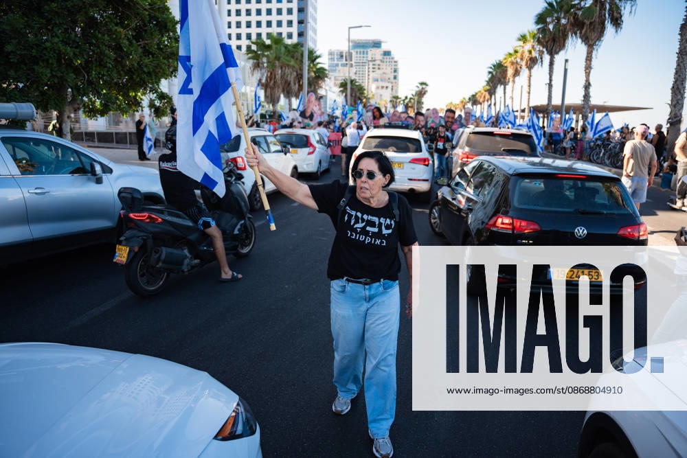 A protester blocks the road near the beach in protest against the Israeli government on the third anniversary of October 7th. Tel Aviv Israel - ZUMAg280 20261007_znp_g280_005