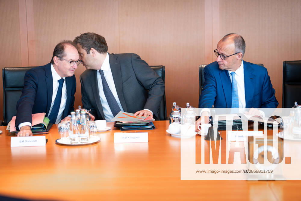 61st Meeting of the Federal Cabinet – Current News, October 7, 2026, Berlin, Chancellor Friedrich Merz (CDU) looks over at Lars Klingbeil, Federal Minister of Finance and Vice Chancellor, and Alexander Dobrindt, Federal Minister of the Interior, who are whispering to each other ahead of the cabinet meeting, a session of the Federal Cabinet at the Federal Chancellery in Berlin, Berlin