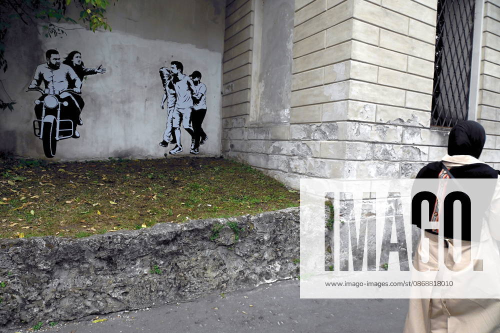 IPA89393694 - MILAN - October 7, 2026 - A mural by Alexandro Palombo, an artwork on display on October 7 at the Museum of Modern Art, located at 16 Via Palestro, dedicated to the young couple kidnapped during the attack on the Nova Music Festival
