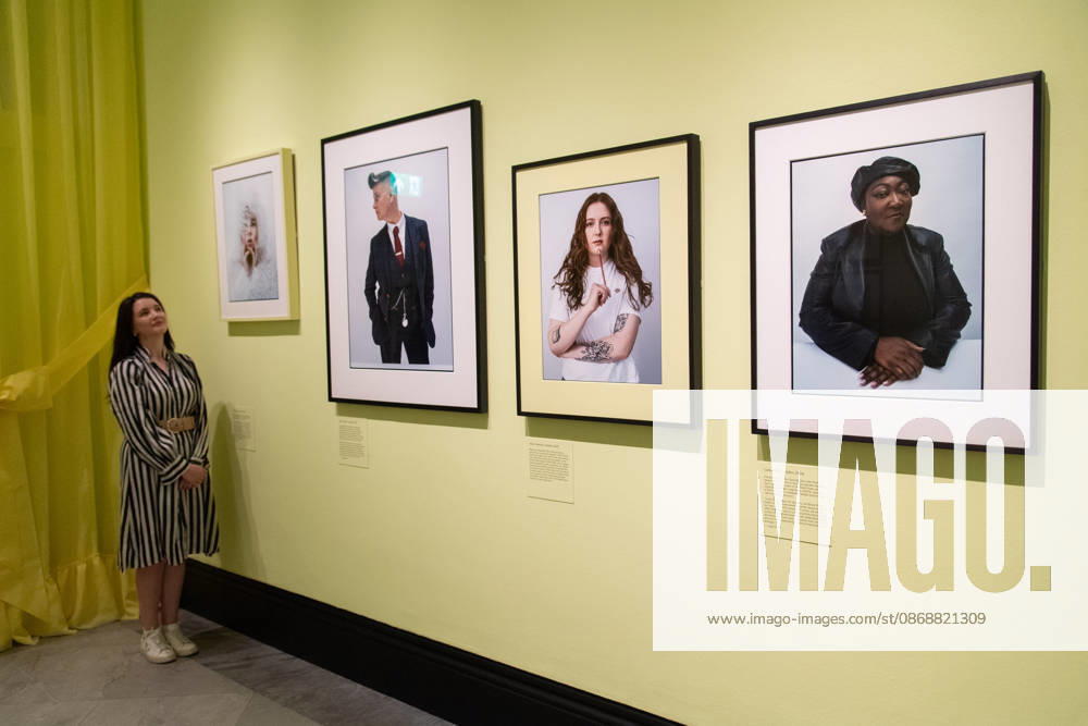 Tim Walker s Fairyland: Love and Legends Photo Call at National Portrait Gallery, London, UK - 7 October 2026 A staff member views (L-R) - Shon Faye , Joelle Taylor , Alice Oseman , Lady Phill all by Tim Walker as part of The National Portrait Gallery s Tim Walker s Fairyland: Love and Legends Exhibition which runs from 9th October 2026 - 7th February 2027 at National Portrait Gallery in London, England, UK on Wednesday 7 October, 2026., Credit:Justin Ng Avalon UK, England, London, National Portrait Gallery