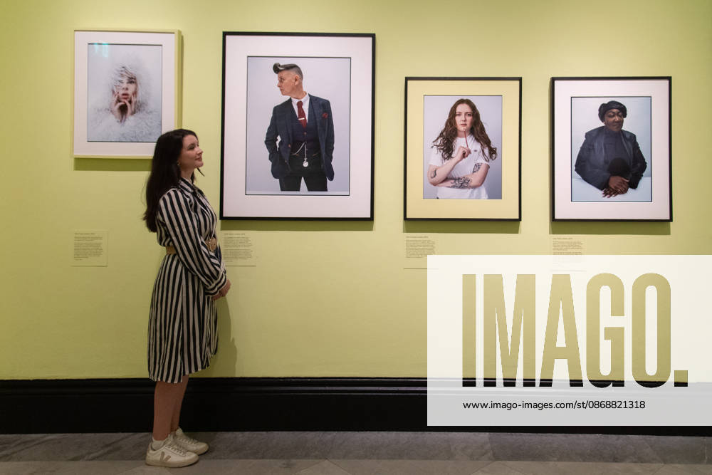 Tim Walker s Fairyland: Love and Legends Photo Call at National Portrait Gallery, London, UK - 7 October 2026 A staff member views (L-R) - Shon Faye , Joelle Taylor , Alice Oseman , Lady Phill all by Tim Walker as part of The National Portrait Gallery s Tim Walker s Fairyland: Love and Legends Exhibition which runs from 9th October 2026 - 7th February 2027 at National Portrait Gallery in London, England, UK on Wednesday 7 October, 2026., Credit:Justin Ng Avalon UK, England, London, National Portrait Gallery