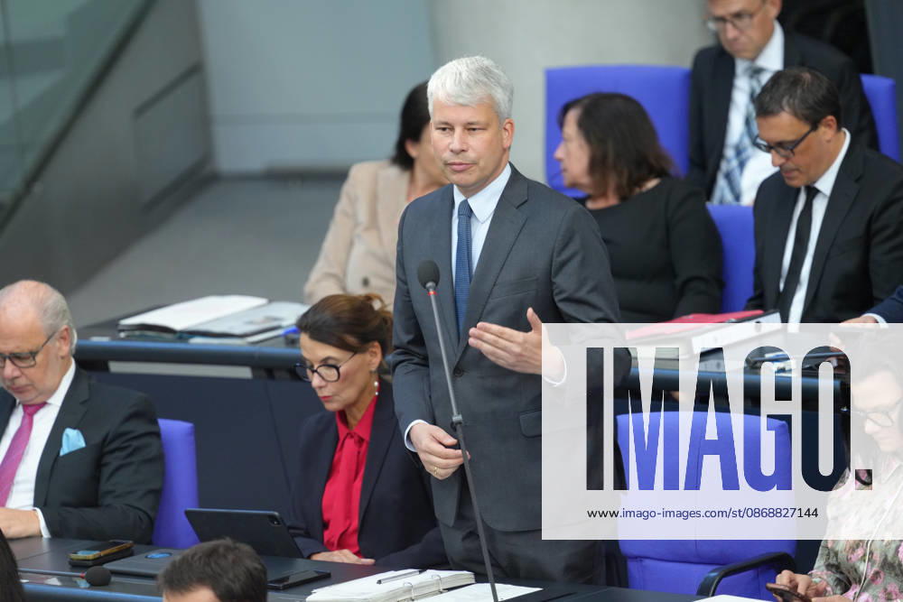 German Bundestag, 98th Plenary Session: Transportation Minister Steffen Bilger answers questions from members of parliament with expressive facial expressions and gestures from his seat on the government bench during the questioning of the federal government at the 98th session of the German Bundestag in Berlin, October 7, 2026, Berlin, Berlin, Germany