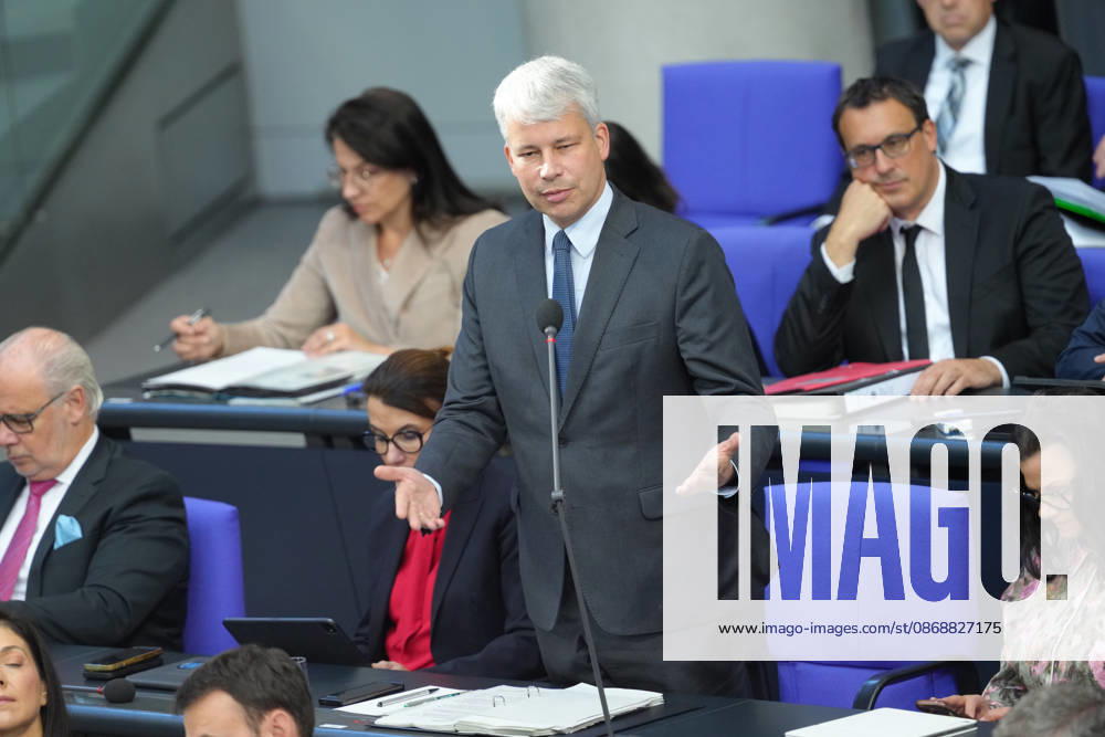 German Bundestag, 98th Plenary Session: Transportation Minister Steffen Bilger answers questions from members of parliament with expressive facial expressions and gestures from his seat on the government bench during the questioning of the federal government at the 98th session of the German Bundestag in Berlin, October 7, 2026, Berlin, Berlin, Germany