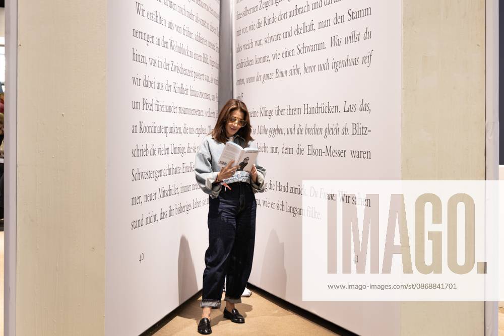 78th Frankfurt Book Fair: A visitor to the Frankfurt Book Fair reads a book inside a giant model of a book. The 78th Frankfurt Book Fair will take place October 7–11, 2026, at the Frankfurt am Main Exhibition Center in Hesse, Germany. 2026-10-07_frankfurter-buchmesse_17