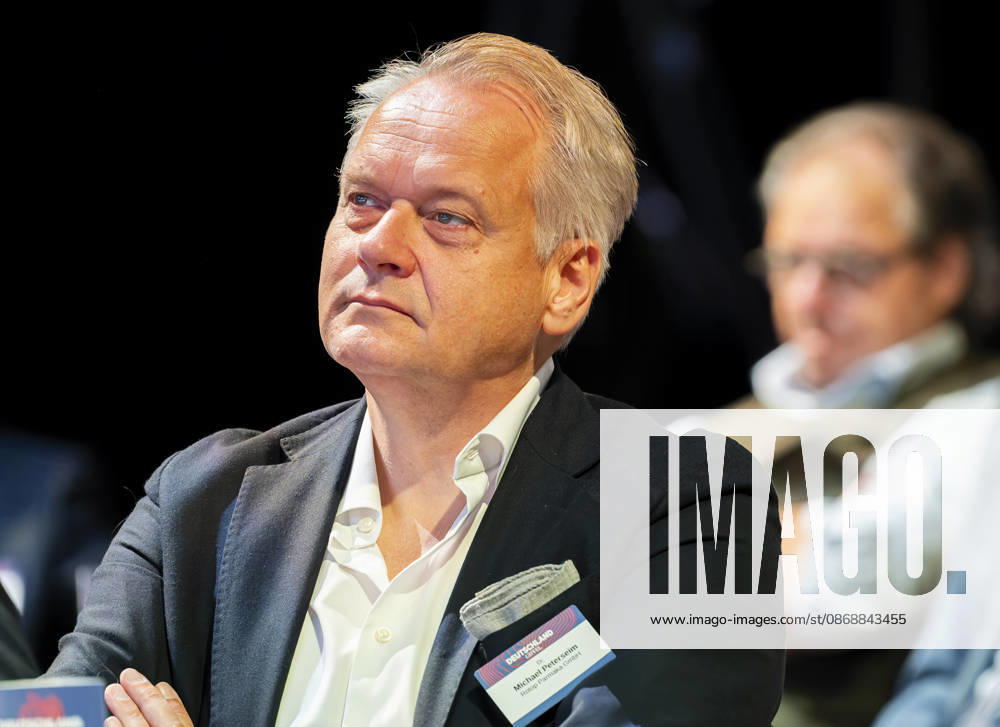 Michael Peterseim, EUR, Germany, Berlin—Michael Peterseim, Chief Financial Officer (CFO) of ROTOP, listens to the Federal Chancellor’s speech at the anniversary event in Berlin celebrating 80 years of *Handelsblatt* and 100 years of *WirtschaftsWoche*.