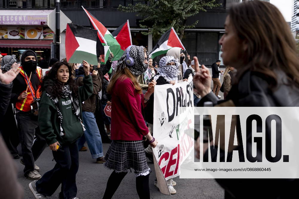A person yells at pro-Palestinian demonstrators as they march in Montreal, on Wednesday, Oct. 7, 2026. Montreal CANADA - ZUMAc35_ 20261007_zaf_c35_055