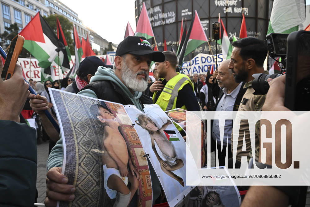 Police in Berlin intervened in demonstrations in support of Palestinians BERLIN, GERMANY - OCTOBER 7: Police officers intervene against a demonstrator carrying photos of Palestinian children killed by Israel in Gaza during a pro-Palestine rally organized by Palestinian associations at the intersection of Zimmer and Friedrich streets in Berlin, Germany on October 7, 2026. Protesters also carried toy dolls wrapped in white shrouds to symbolize the children who lost their lives in Israeli attacks. Halil Sagirkaya Anadolu Berlin Germany. Editorial use only. Please get in touch for any other usage.
