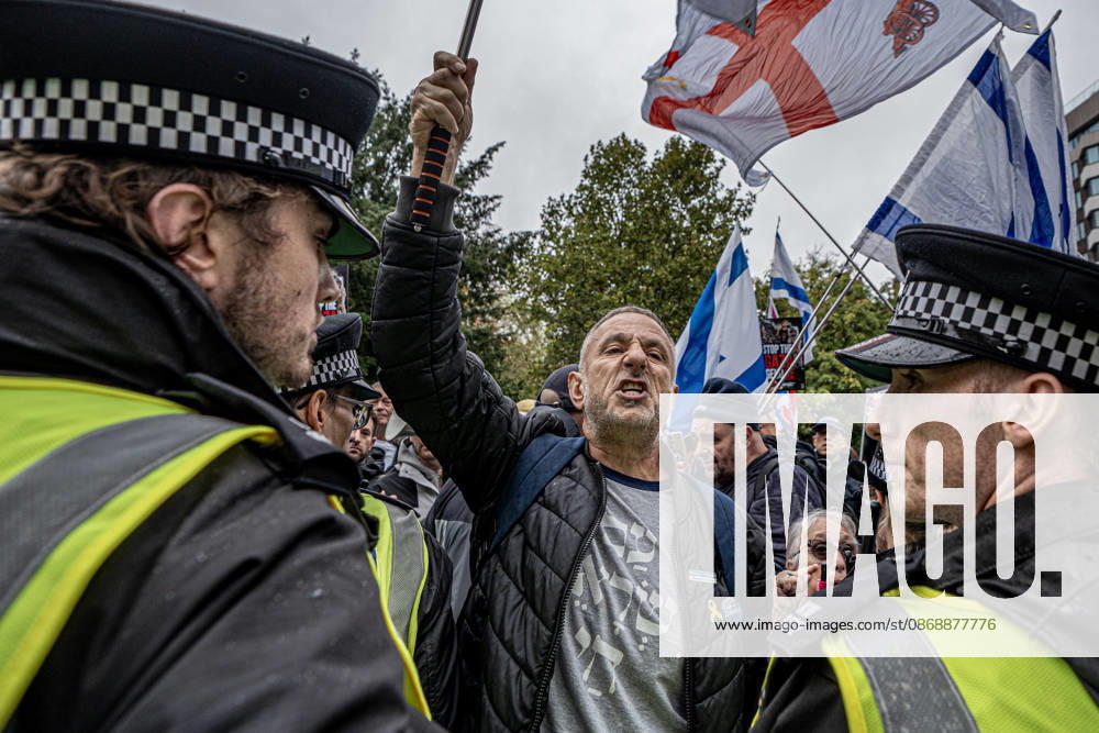 Pro-Israeil counter protestors challenge pro-Palestine demonstrators in London, UK - 7 OCT 2026. A police cordon seen separating protestors chanting slogans while holding flags during the demonstration in central London on the 3rd anniversary of Hamas attack. Pro-Palestine activists from Central London Universities chose the 3rd anniversary of the October 7th attack by Hamas to protest against Israel’s war on Gaza. They clashed en route with pro-Israeli counter protestors. The demonstration was arranged by an inter-uni coalition that includes King’s College and LSE. London United Kingdom