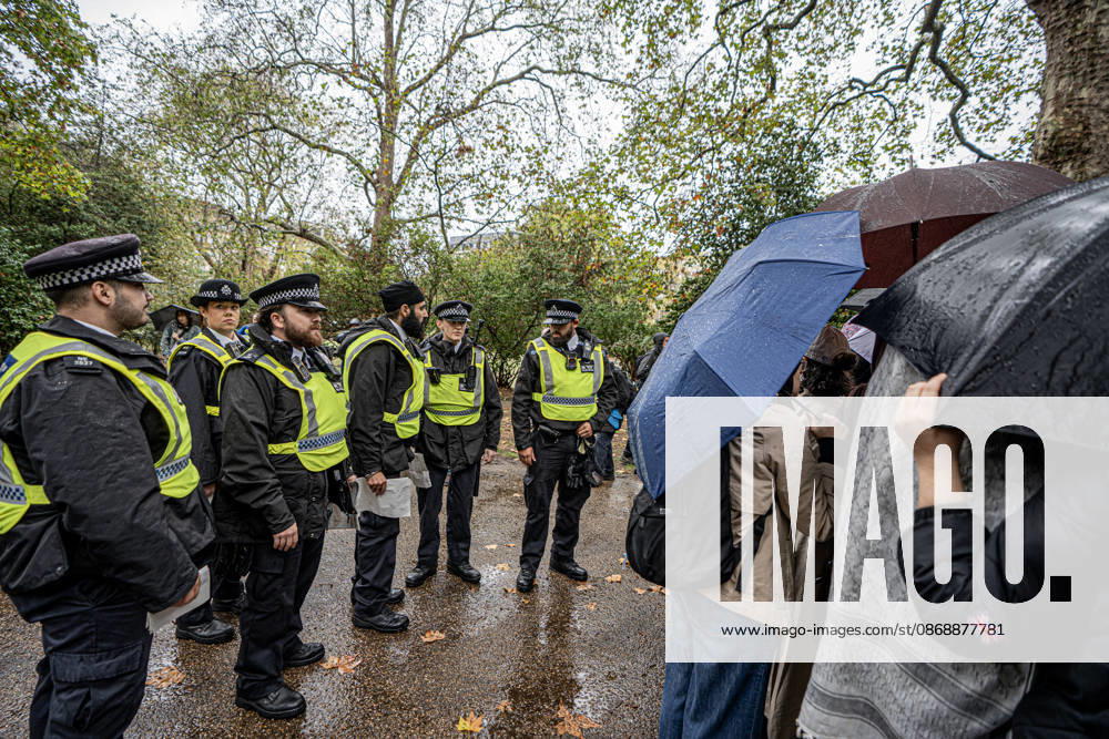 Pro-Israeil counter protestors challenge pro-Palestine demonstrators in London, UK - 7 OCT 2026. Police seen standing as pro-Palestine activists from London universities shield themselves behind a protective wall of umbrellas on their march. Pro-Palestine activists from Central London Universities chose the 3rd anniversary of the October 7th attack by Hamas to protest against Israel’s war on Gaza. They clashed en route with pro-Israeli counter protestors. The demonstration was arranged by an inter-uni coalition that includes King’s College and LSE. London United Kingdom