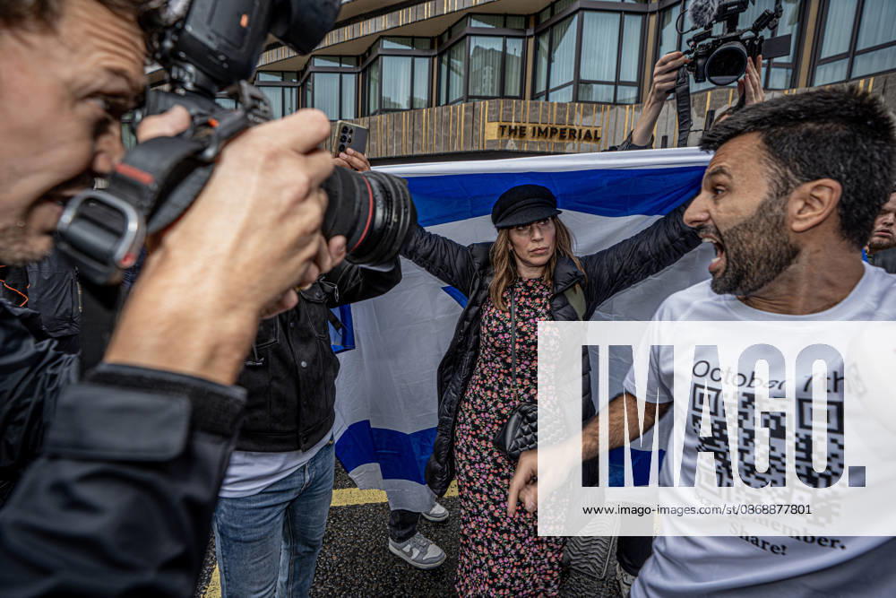 Pro-Israeil counter protestors challenge pro-Palestine demonstrators in London, UK - 7 OCT 2026. A woman seen holding a large flag during the 3rd anniversary of the October 7th attack by Hamas to protest against Israel’s war on Gaza while other protesters filming in front of her. Pro-Palestine activists from Central London Universities chose the 3rd anniversary of the October 7th attack by Hamas to protest against Israel’s war on Gaza. They clashed en route with pro-Israeli counter protestors. The demonstration was arranged by an inter-uni coalition that includes King’s College and LSE. London United Kingdom