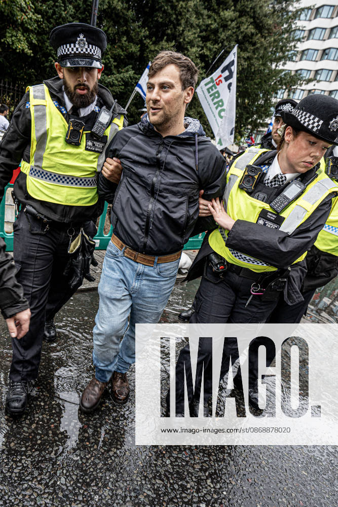 Pro-Israeil counter protestors challenge pro-Palestine demonstrators in London, UK - 7 OCT 2026. A pro-Israeli counter-protestor is arrested for breaching the peace and not maintaining sufficient distance from pro-Palestine demonstrators. Pro-Palestine activists from Central London Universities chose the 3rd anniversary of the October 7th attack by Hamas to protest against Israel’s war on Gaza. They clashed en route with pro-Israeli counter protestors. The demonstration was arranged by an inter-uni coalition that includes King’s College and LSE. London United Kingdom