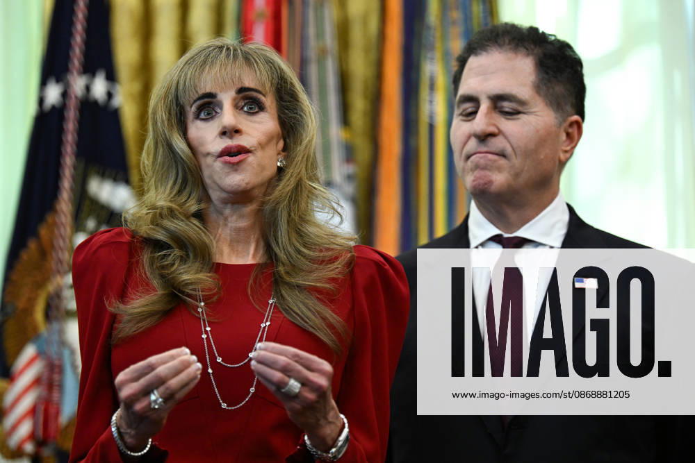 WASHINGTON, DC - OCT. 7: Susan Dell, wife of Dell Technologies CEO Michael Dell, left, speaks during an announcement with United States President Donald J Trump on Trump Accounts in the Oval Office of the White House in Washington, DC, USA, on Wednesday, October 7, 2026. Looking on from right is Michael S Dell, founder, chairman, and CEO of Dell Technologies.