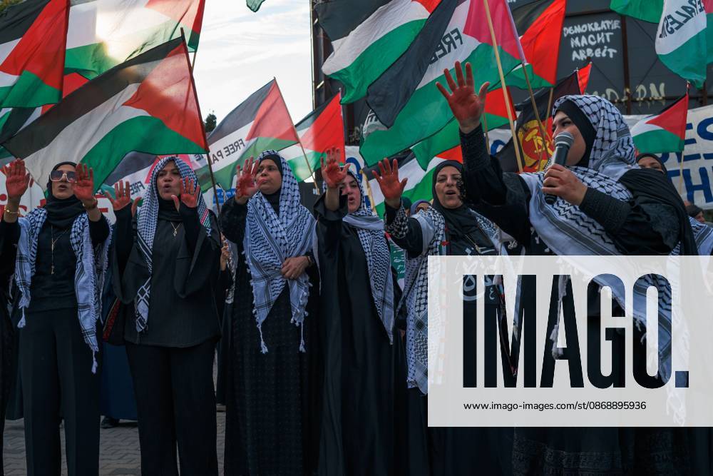BERLIN, GERMANY, OCTOBER 7, 2026: Demonstrators gather at Checkpoint Charlie in central Berlin to mark three years since the start of the Gaza war. Participants protest against Israelâ€⠢s military actions in Gaza, which they describe as genocide, and express solidarity with Palestinians. Berlin Germany - ZUMAq101 20261007_zna_q101_404