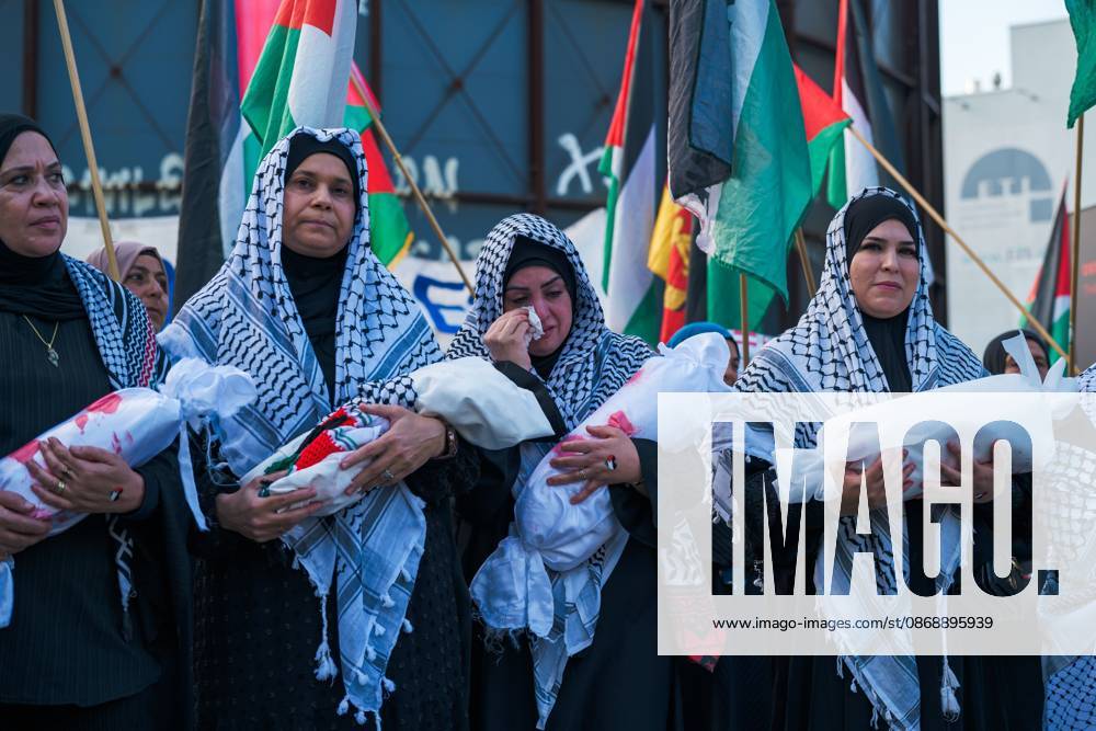 BERLIN, GERMANY, OCTOBER 7, 2026: Demonstrators gather at Checkpoint Charlie in central Berlin to mark three years since the start of the Gaza war. Participants protest against Israelâ€⠢s military actions in Gaza, which they describe as genocide, and express solidarity with Palestinians. Berlin Germany - ZUMAq101 20261007_zna_q101_405