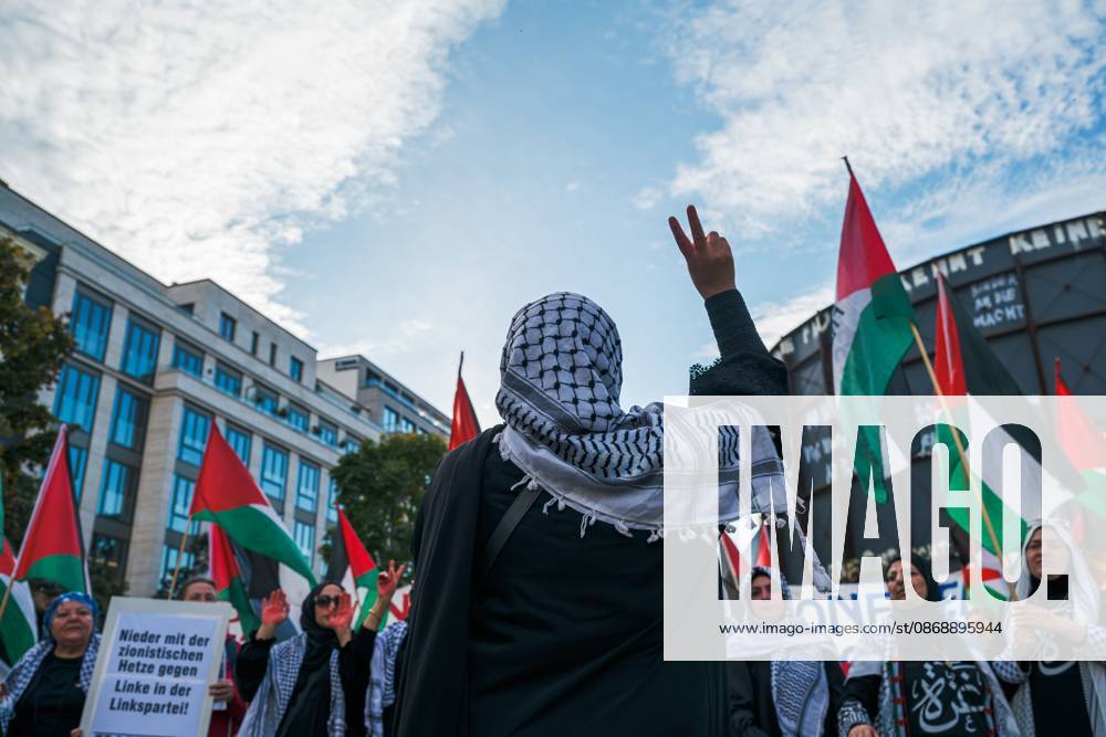 BERLIN, GERMANY, OCTOBER 7, 2026: Demonstrators gather at Checkpoint Charlie in central Berlin to mark three years since the start of the Gaza war. Participants protest against Israelâ€⠢s military actions in Gaza, which they describe as genocide, and express solidarity with Palestinians. Berlin Germany - ZUMAq101 20261007_zna_q101_407