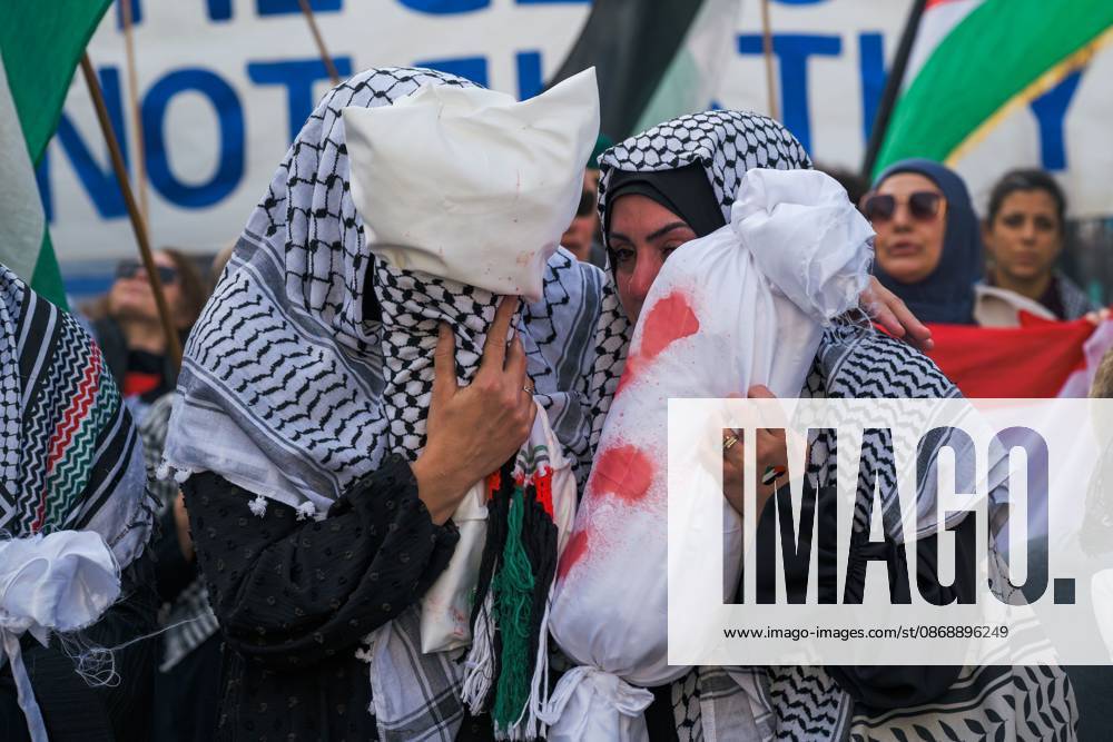 BERLIN, GERMANY, OCTOBER 7, 2026: Demonstrators gather at Checkpoint Charlie in central Berlin to mark three years since the start of the Gaza war. Participants protest against IsraelÃ¢â‚¬â ¢s military actions in Gaza, which they describe as genocide, and express solidarity with Palestinians. Berlin Germany - ZUMAq101 20261007_zna_q101_410
