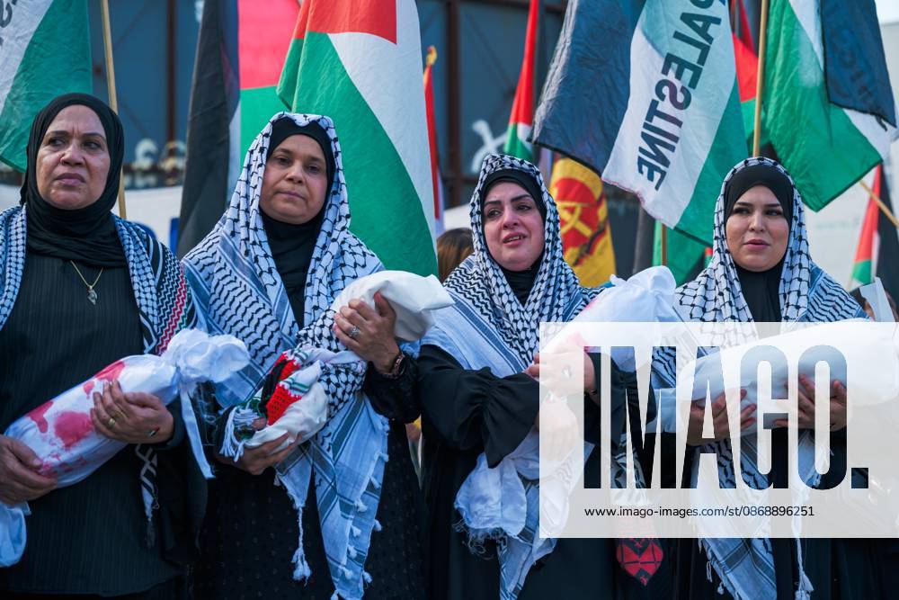 BERLIN, GERMANY, OCTOBER 7, 2026: Demonstrators gather at Checkpoint Charlie in central Berlin to mark three years since the start of the Gaza war. Participants protest against IsraelÃ¢â‚¬â ¢s military actions in Gaza, which they describe as genocide, and express solidarity with Palestinians. Berlin Germany - ZUMAq101 20261007_zna_q101_411