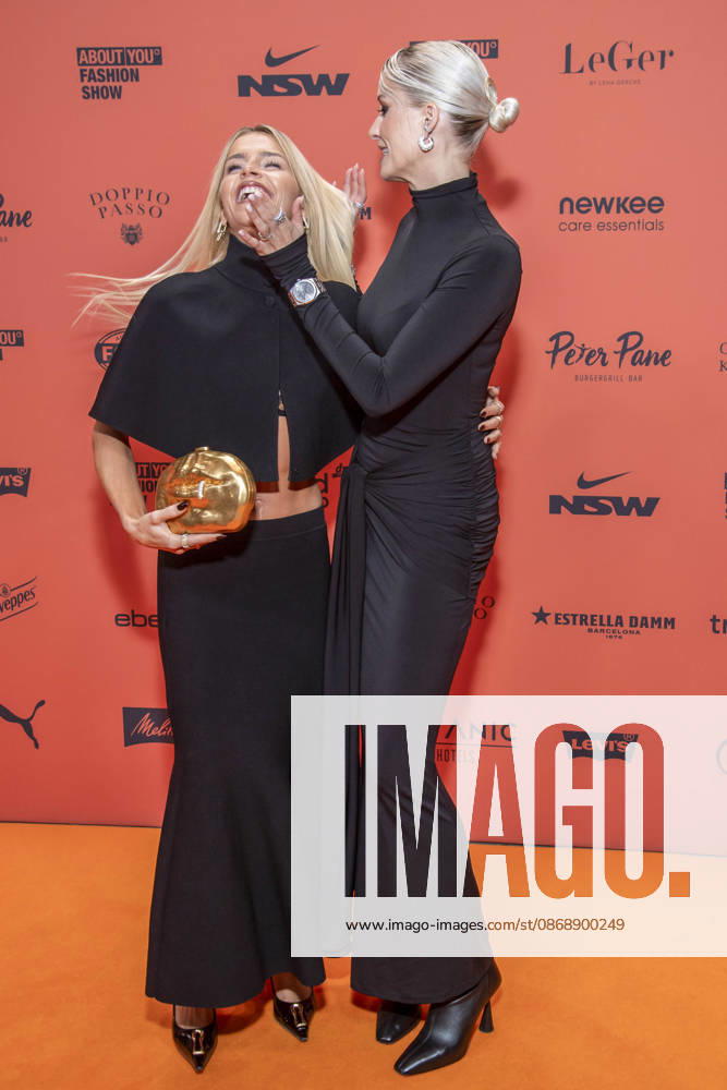 ABB ABOUTYOU Caroline Daur and Lena Gercke as guests on the orange carpet at the ABOUT YOU Opera Fashion Show at the Admiralspalast on October 7, 2026, in Berlin, Germany
