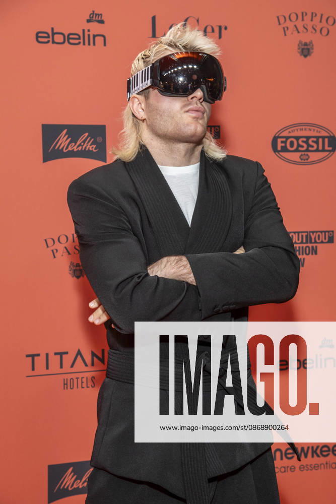 ABB ABOUTYOU Ski Aggu as a guest on the orange carpet at the ABOUT YOU Opera Fashion Show at the Admiralspalast on October 7, 2026, in Berlin, Germany