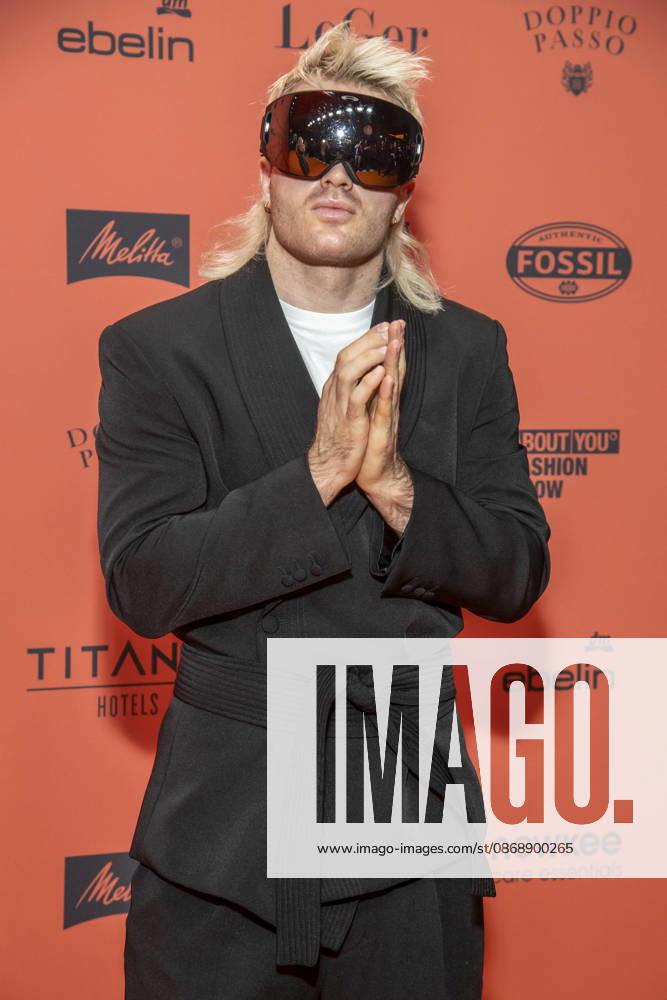 ABB ABOUTYOU Ski Aggu as a guest on the orange carpet at the ABOUT YOU Opera Fashion Show at the Admiralspalast on October 7, 2026, in Berlin, Germany