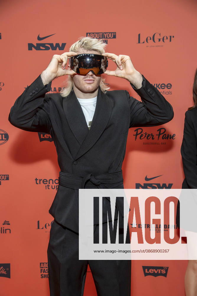 ABB ABOUTYOU Ski Aggu as a guest on the orange carpet at the ABOUT YOU Opera Fashion Show at the Admiralspalast on October 7, 2026, in Berlin, Germany