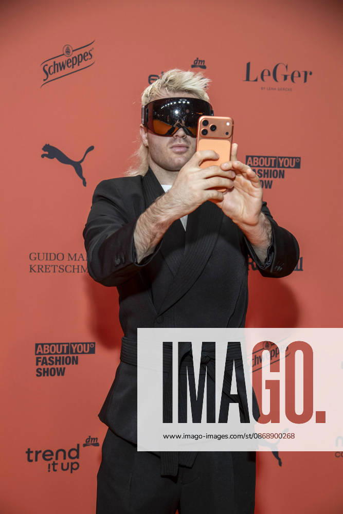 ABB ABOUTYOU Ski Aggu as a guest on the orange carpet at the ABOUT YOU Opera Fashion Show at the Admiralspalast on October 7, 2026, in Berlin, Germany