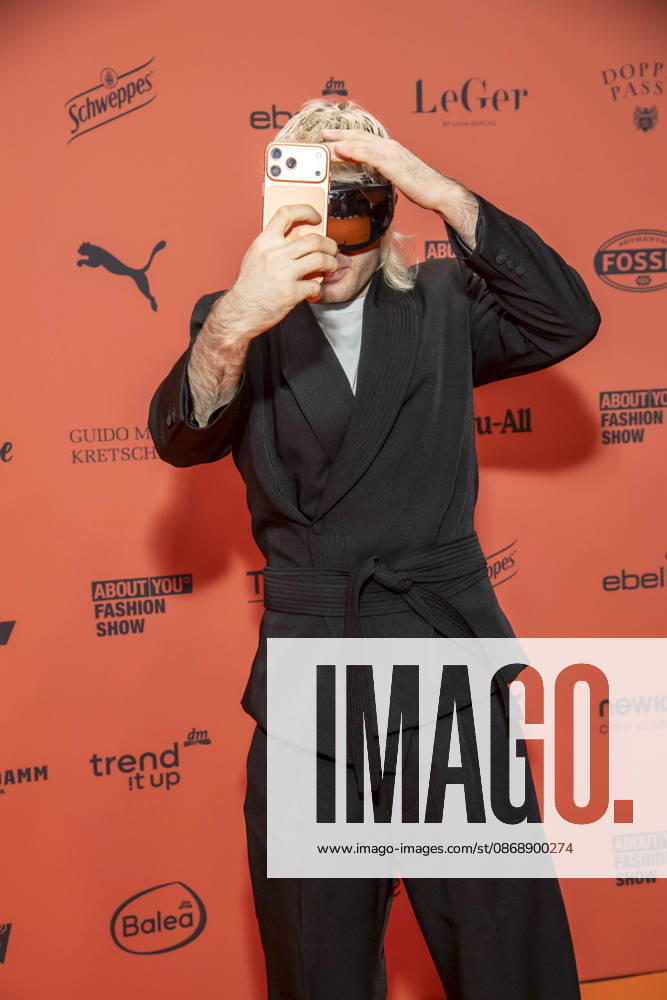 ABB ABOUTYOU Ski Aggu as a guest on the orange carpet at the ABOUT YOU Opera Fashion Show at the Admiralspalast on October 7, 2026, in Berlin, Germany
