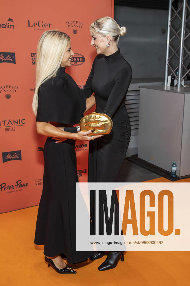 ABB ABOUTYOU Caroline Daur and Lena Gercke as guests on the orange carpet at the ABOUT YOU Opera Fashion Show at the Admiralspalast on October 7, 2026, in Berlin, Germany