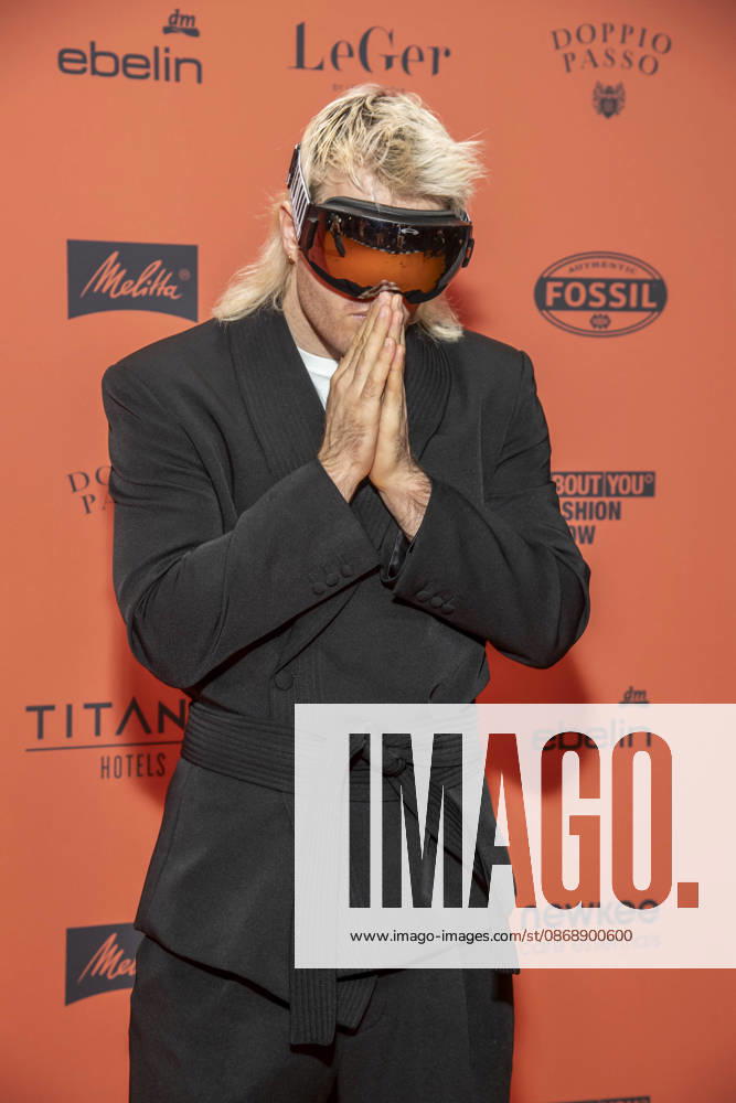 ABB ABOUTYOU Ski Aggu as a guest on the orange carpet at the ABOUT YOU Opera Fashion Show at the Admiralspalast on October 7, 2026, in Berlin, Germany