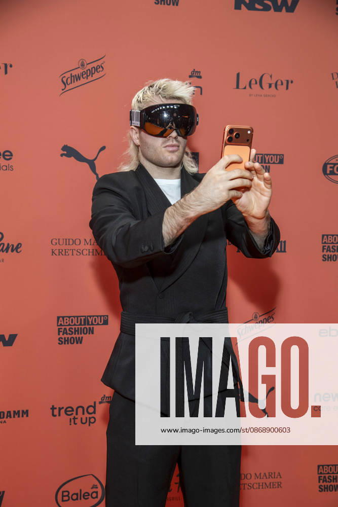 ABB ABOUTYOU Ski Aggu as a guest on the orange carpet at the ABOUT YOU Opera Fashion Show at the Admiralspalast on October 7, 2026, in Berlin, Germany