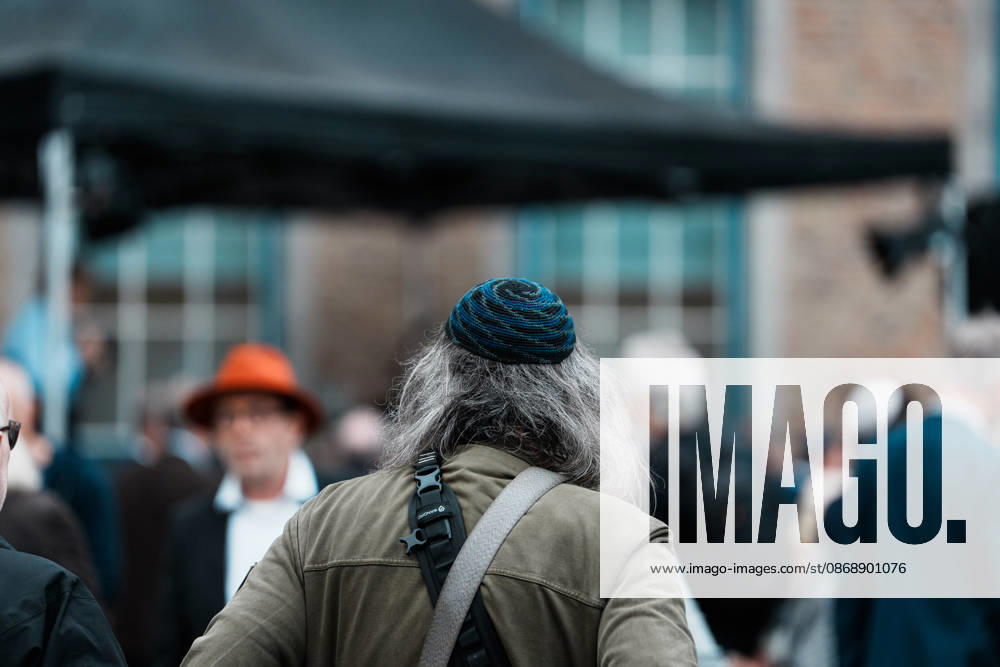 Rally in Düsseldorf marking the anniversary of Hamas s terrorist attack on Israel on October 7, 2023, and protesting anti-Semitism; man wearing a kippah