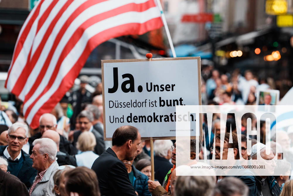 Rally in Düsseldorf marking the anniversary of Hamas’s terrorist attack on Israel on October 7, 2023, and against anti-Semitism; sign reading Düsseldorf: Colorful and Democratic