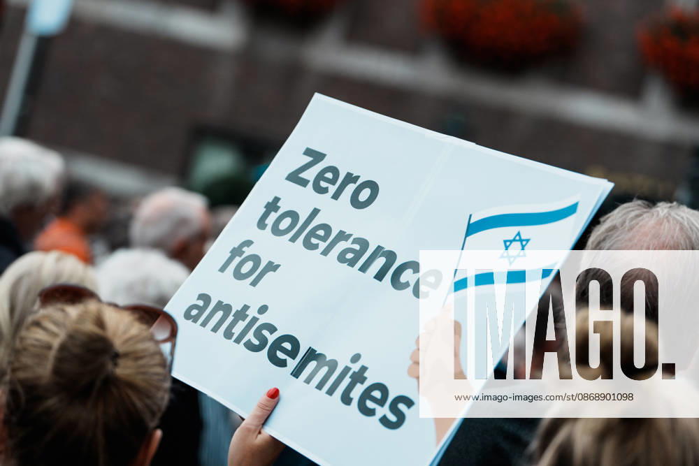 Rally in Düsseldorf marking the anniversary of Hamas’s terrorist attack on Israel on October 7, 2023, and against anti-Semitism; sign reading Zero tolerance for anti-Semites, no tolerance
