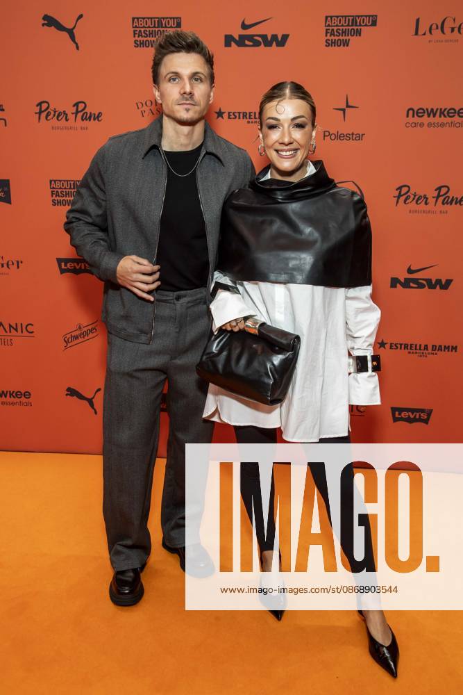 ABB ABOUTYOU Frederic Bossier and Sabrina Nickel as guests on the orange carpet at the ABOUT YOU Opera Fashion Show at the Admiralspalast on October 7, 2026, in Berlin, Germany