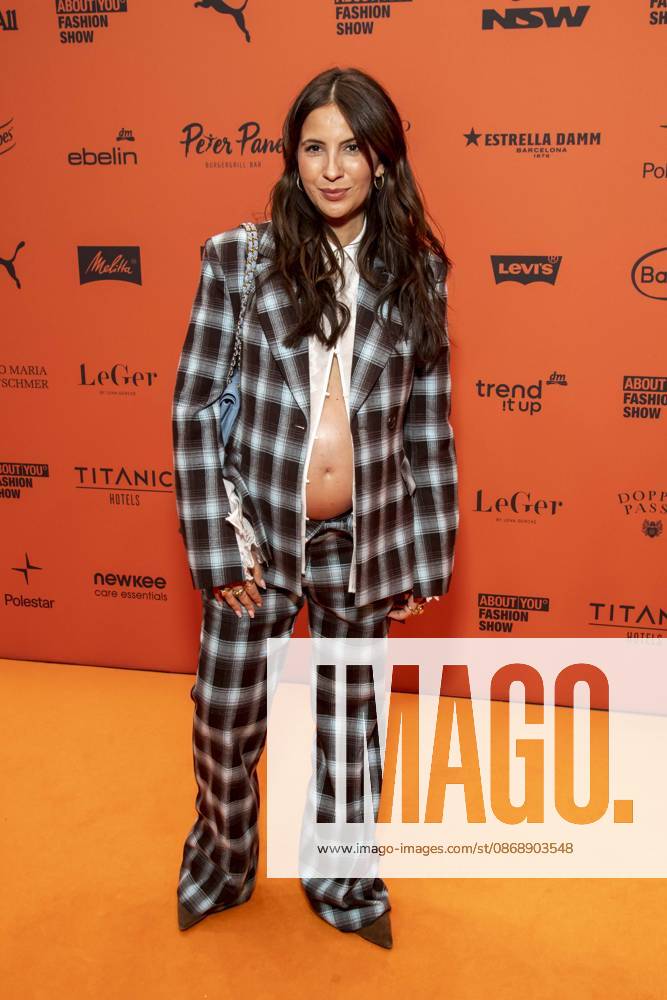 ABB ABOUTYOU Chryssanthi Kavazi, showing off her baby bump, walks the Orange Carpet at the ABOUT YOU Opera Fashion Show at the Admiralspalast on October 7, 2026, in Berlin, Germany