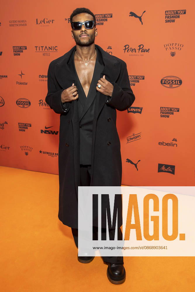 ABB ABOUTYOU Tijan Njie walks the orange carpet at the ABOUT YOU Opera Fashion Show at the Admiralspalast on October 7, 2026, in Berlin, Germany