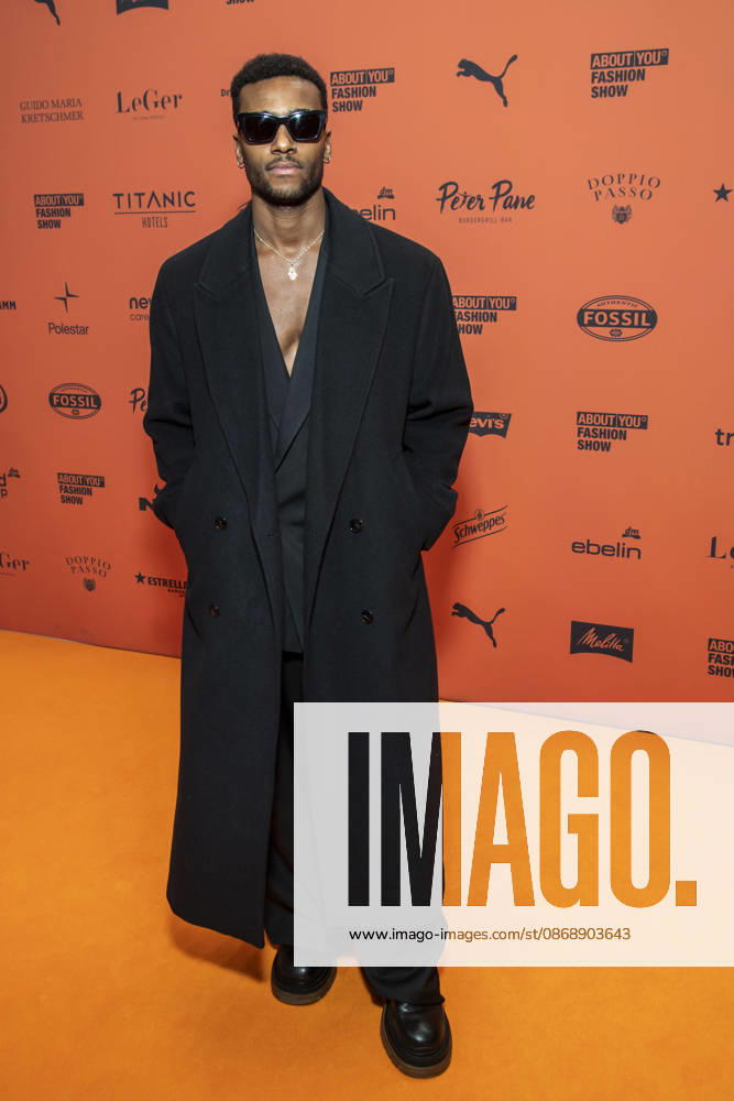 ABB ABOUTYOU Tijan Njie walks the orange carpet at the ABOUT YOU Opera Fashion Show at the Admiralspalast on October 7, 2026, in Berlin, Germany