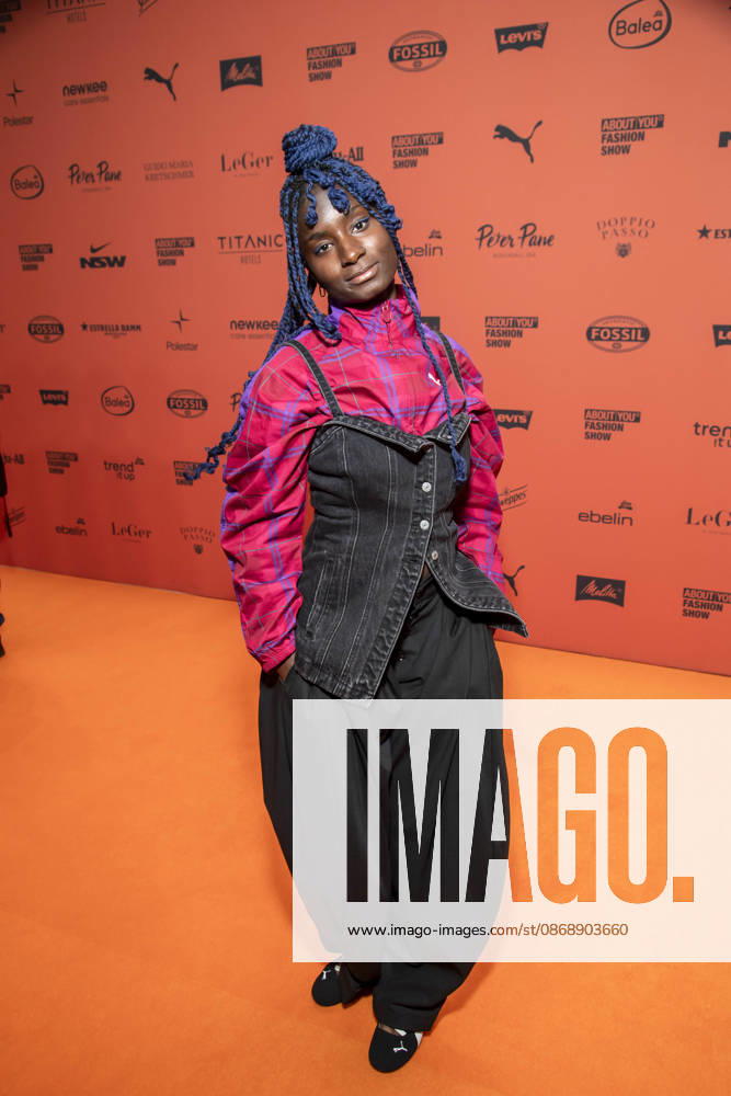 ABB ABOUTYOU Oumi Janta walks the orange carpet at the ABOUT YOU Opera Fashion Show at the Admiralspalast on October 7, 2026, in Berlin, Germany