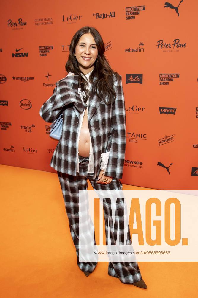 ABB ABOUTYOU Chryssanthi Kavazi, showing off her baby bump, walks the Orange Carpet at the ABOUT YOU Opera Fashion Show at the Admiralspalast on October 7, 2026, in Berlin, Germany