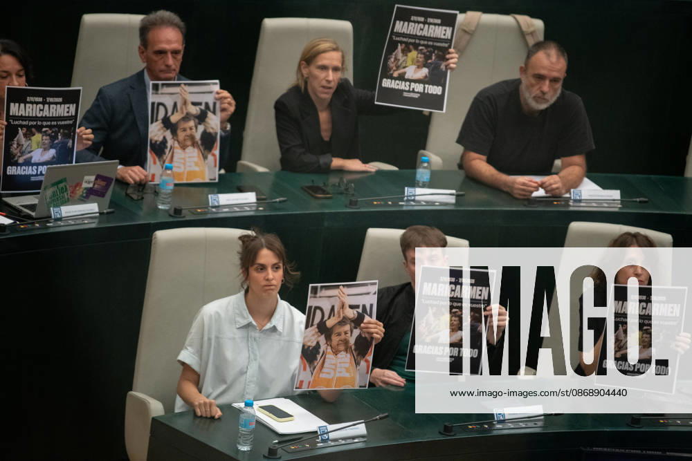 The Madrid City Council holds a special plenary session to approve two plans to increase housing. Más Madrid’s spokesperson on the City Council, Rita Maestre, and Más Madrid council members hold up a poster of Maricarmen during a special plenary session at the Palacio de Cibeles on October 8, 2026, in Madrid, Spain. The Madrid City Council is holding a special plenary session to give the green light to two special plans initially approved by the Governing Board, one of which will allow for the establishment of any type of lodging—including aparthotels, flex living, guesthouses, or lodging facilities on more than 240 industrial-use lots spread across eight districts of the capital, and one that amends municipal regulations to allow for the