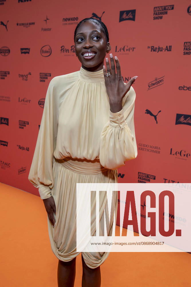 ABB ABOUTYOU Toni Dreher Adenuga as a guest on the Orange Carpet at the ABOUT YOU Opera Fashion Show at the Admiralspalast on October 7, 2026, in Berlin, Germany