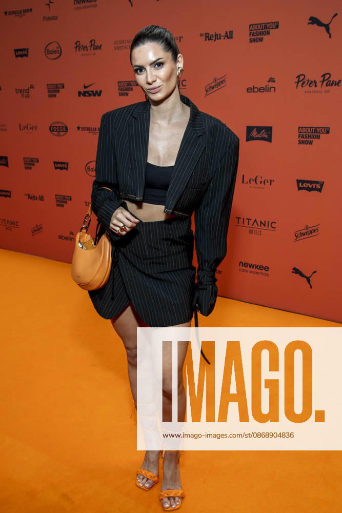 ABB ABOUTYOU Michele de Roos walks the Orange Carpet at the ABOUT YOU Opera Fashion Show at the Admiralspalast on October 7, 2026, in Berlin, Germany