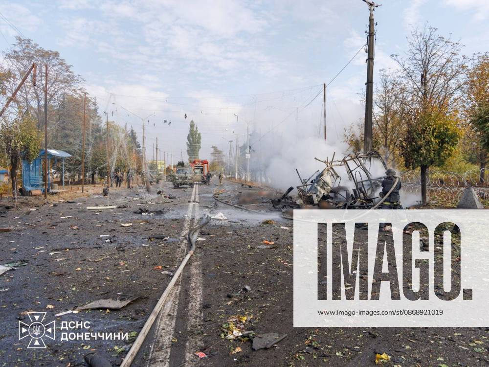 33 killed and 18 injured in Russian strike on passenger buses in Donetsk region s Kramatorsk KRAMATORSK, UKRAINE - OCTOBER 8: (---- - MANDATORY CREDIT - UKRAINIAN STATE EMERGENCY SERVICE HANDOUT - NO MARKETING NO ADVERTISING CAMPAIGNS - DISTRIBUTED AS A SERVICE TO CLIENTS----) Firefighters perform cooling and search operations on the burnt shell of a passenger bus following a Russian missile and aerial bomb strike in Kramatorsk, Donetsk region, Ukraine on October 8, 2026. The strike targeted two civilian buses, killing 30 people in Kramatorsk, while shelling in nearby Bilenke claimed three more lives, bringing the total regional casualties to 33 dead and 18 injured. Emergency personnel recovered a victim from under the