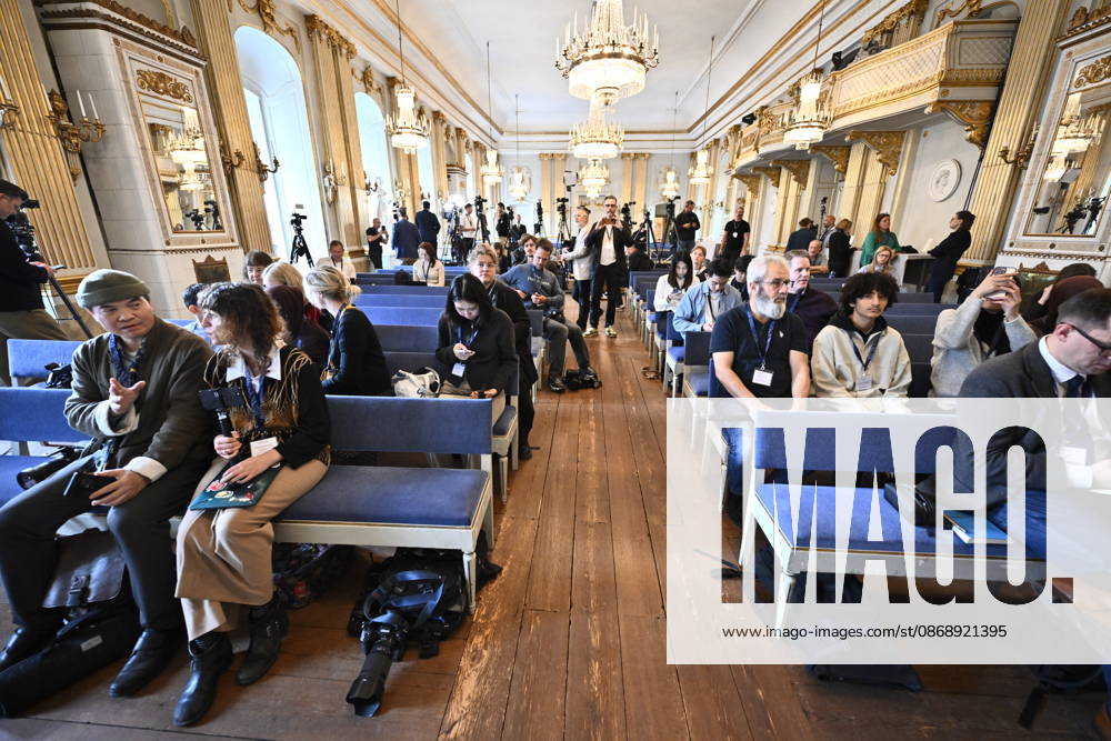 Members of the media and members of the public wait at the Stock Exchange Building (Börshuset) for Ingrid Carlberg, Permanent Secretary of the Swedish Academy, to announce the recipient of the 2026 Nobel Prize in Literature in Stockholm, Sweden, on October 8, 2026 STOCKHOLM SWEDEN